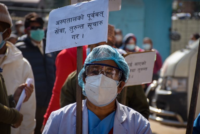 In Pictures: Health workers protest for safety